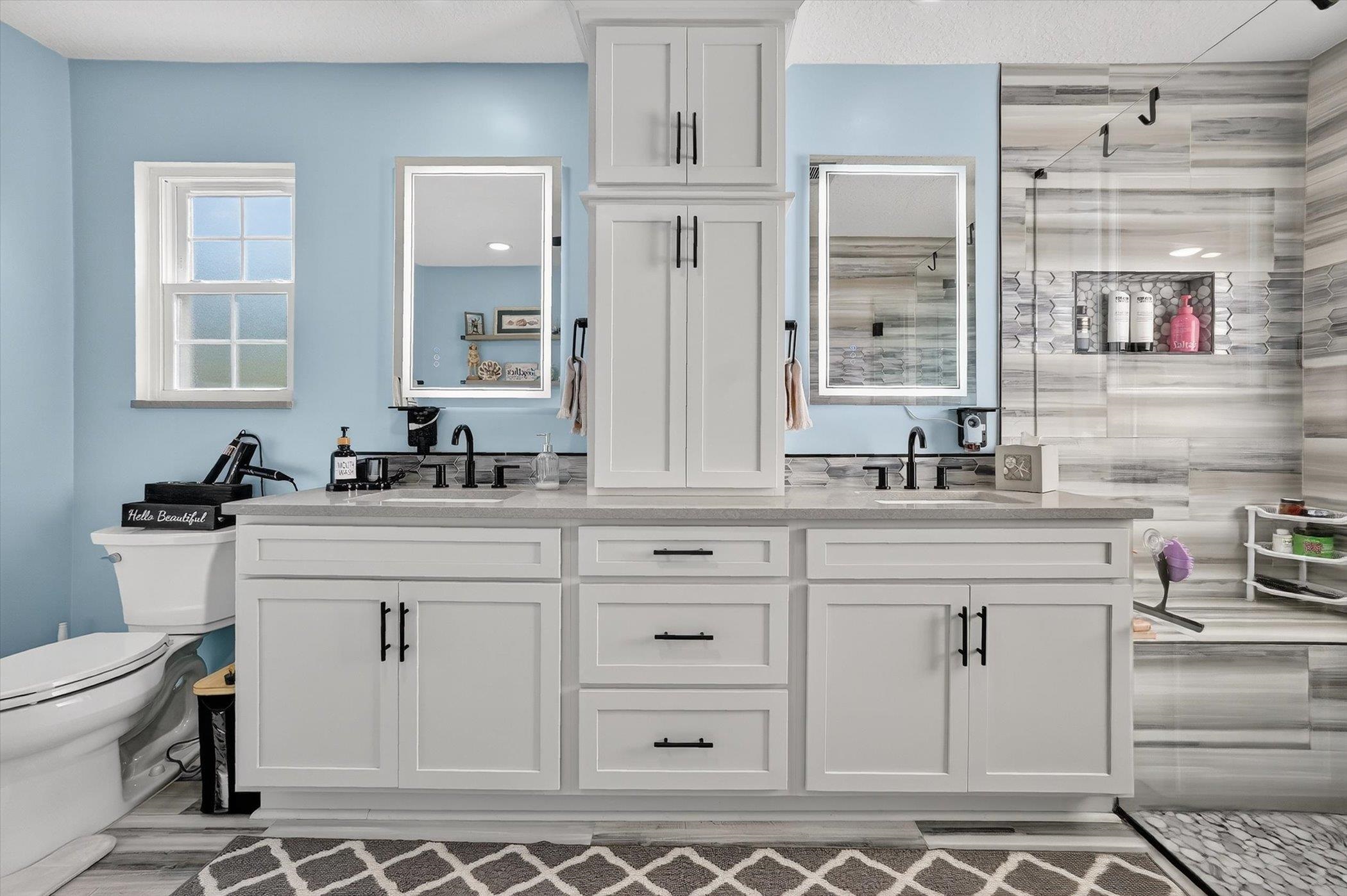 229 Yale Road St. Augustine, FL 32086 - Photo 18 of 47 Bathroom with a stall shower and double vanity