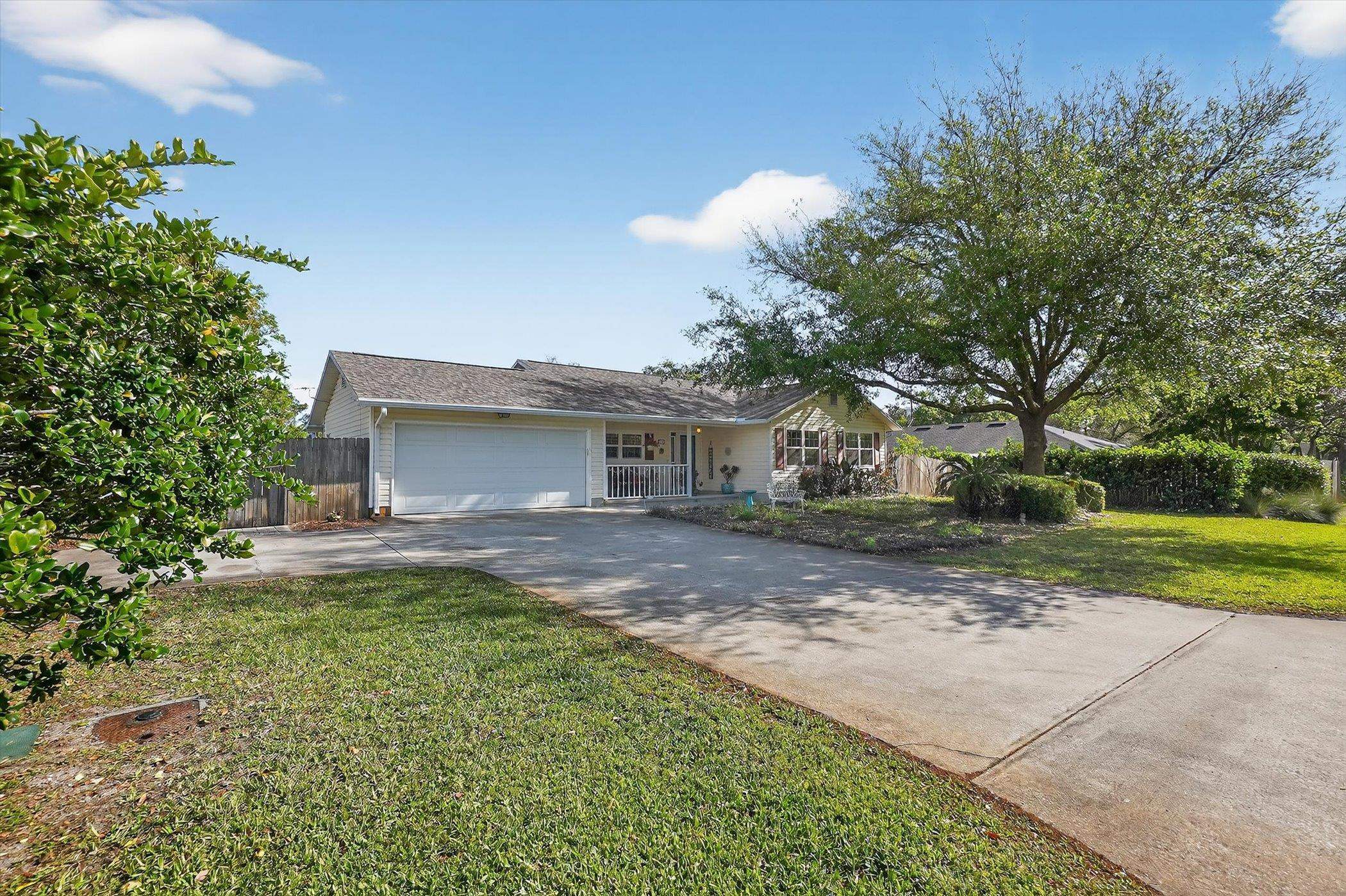 229 Yale Road St. Augustine, FL 32086 - Photo 25 of 47 Ranch-style home with a garage, driveway, and covered porch