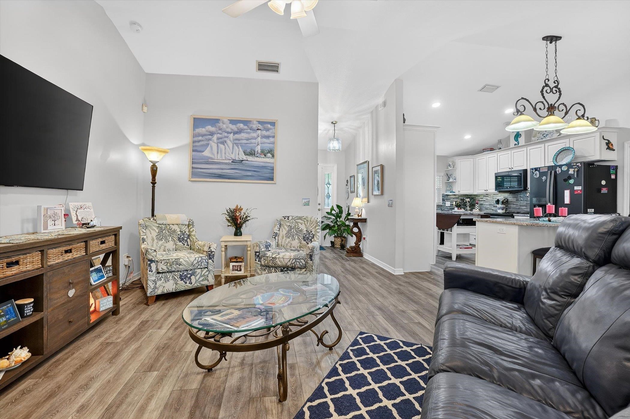 229 Yale Road St. Augustine, FL 32086 - Photo 32 of 47 Living area featuring light wood-style flooring, ceiling fan, and vaulted ceiling