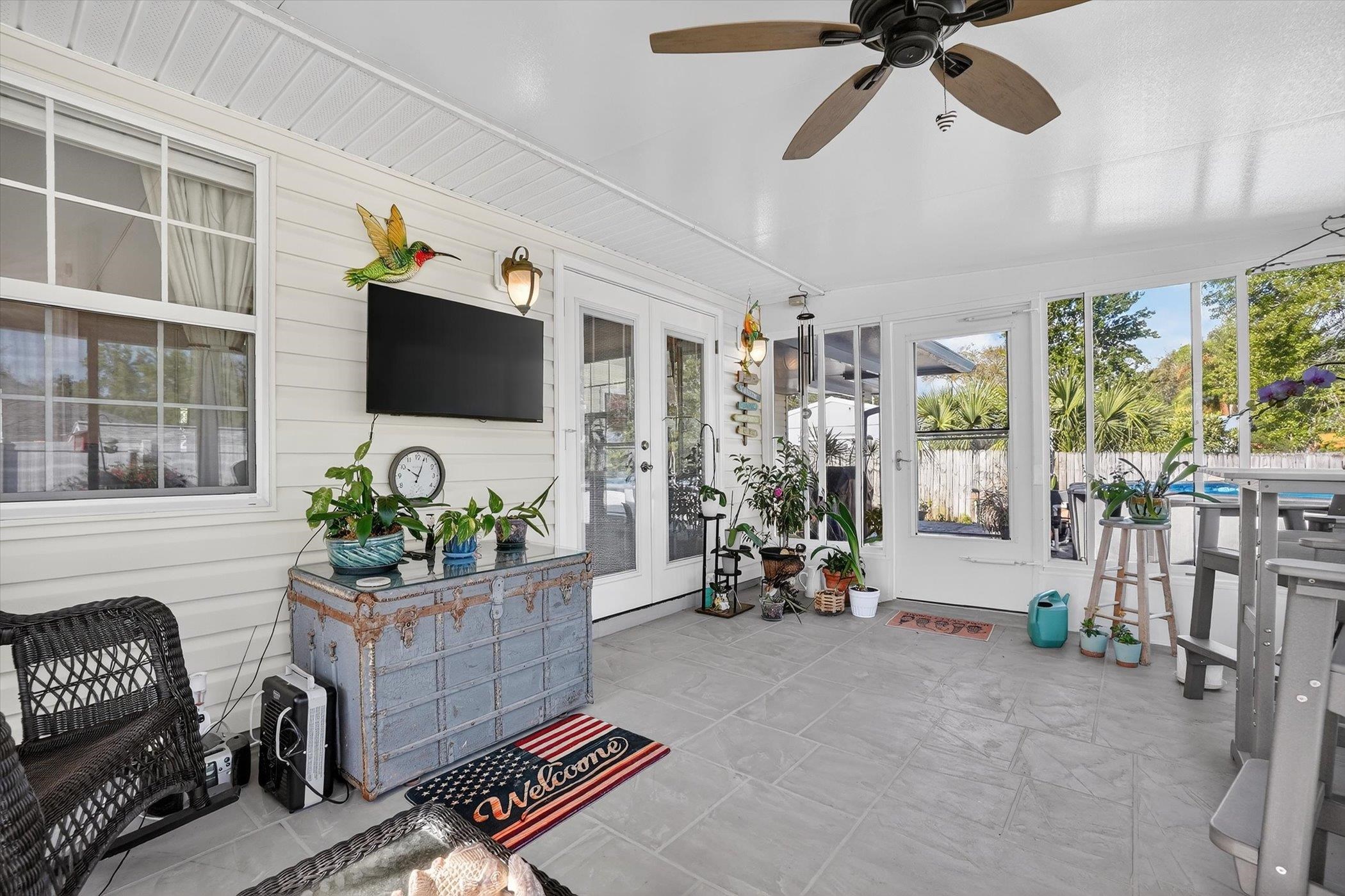 229 Yale Road St. Augustine, FL 32086 - Photo 37 of 47 Sunroom / solarium with french doors, healthy amount of natural light, and ceiling fan