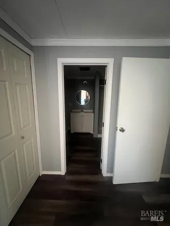 a bathroom with a sink a toilet a mirror and shower