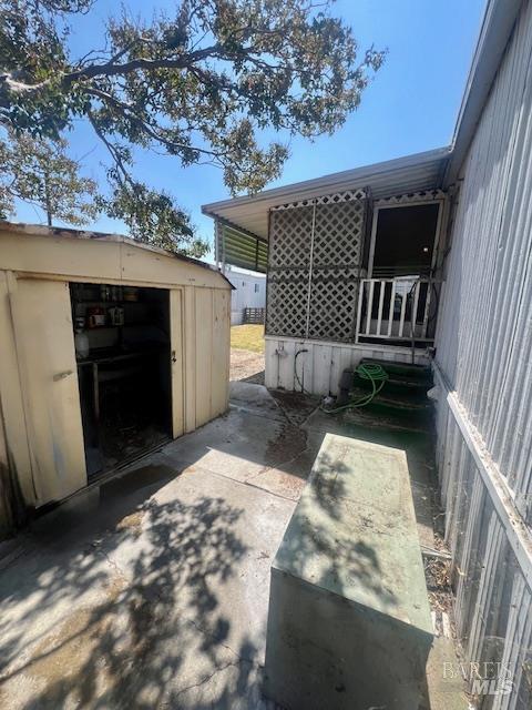 50 River Road, Unit 74 Isleton, CA 94571 - Photo 21 of 21 a view of backyard with barbeque grill and wooden fence