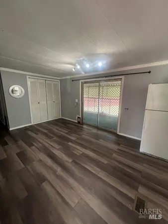 a view of an empty room and window