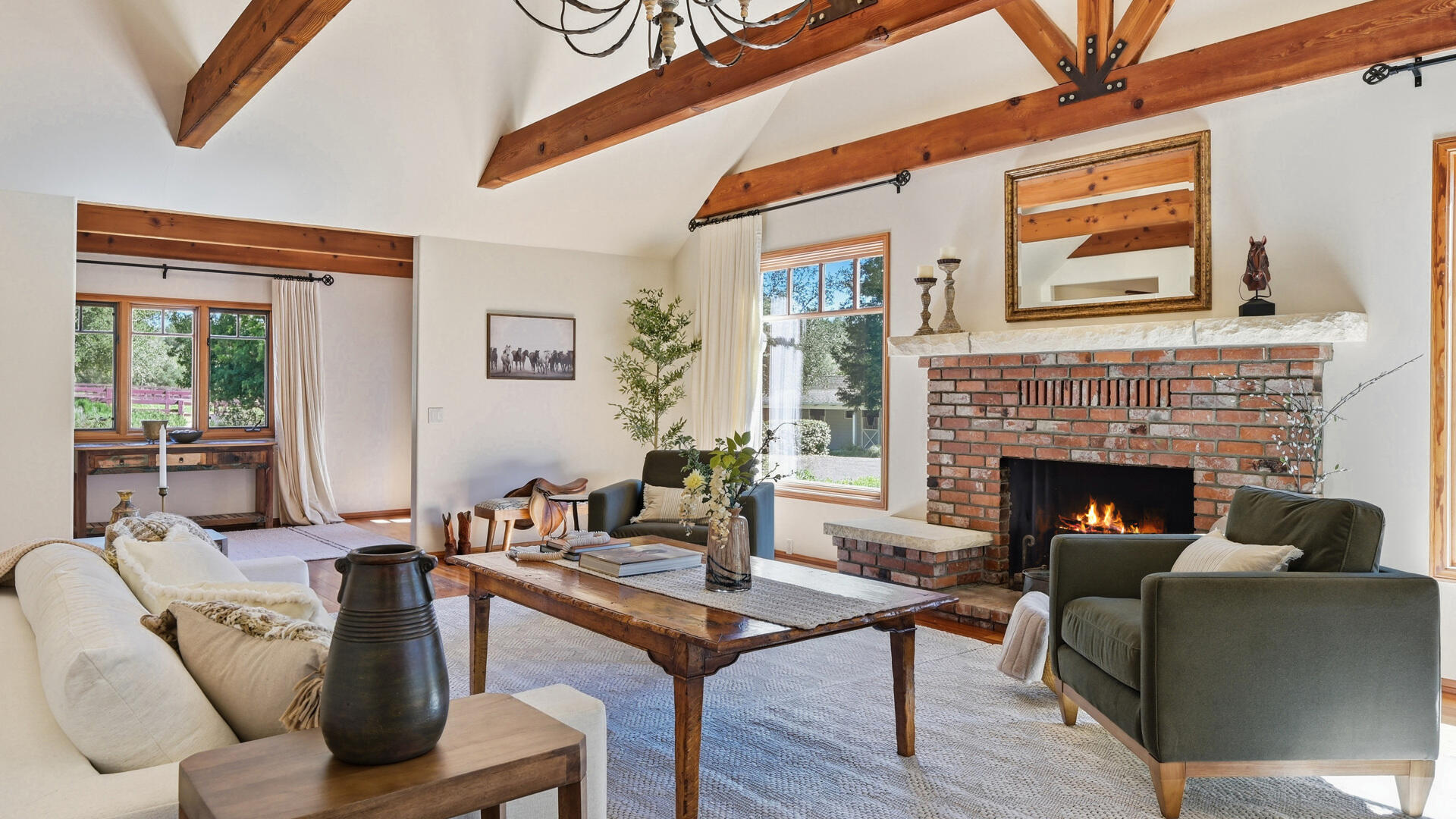1642 Alamo Pintado Road Solvang, CA 93463 - Photo 11 of 85 a living room with furniture a table and a fireplace