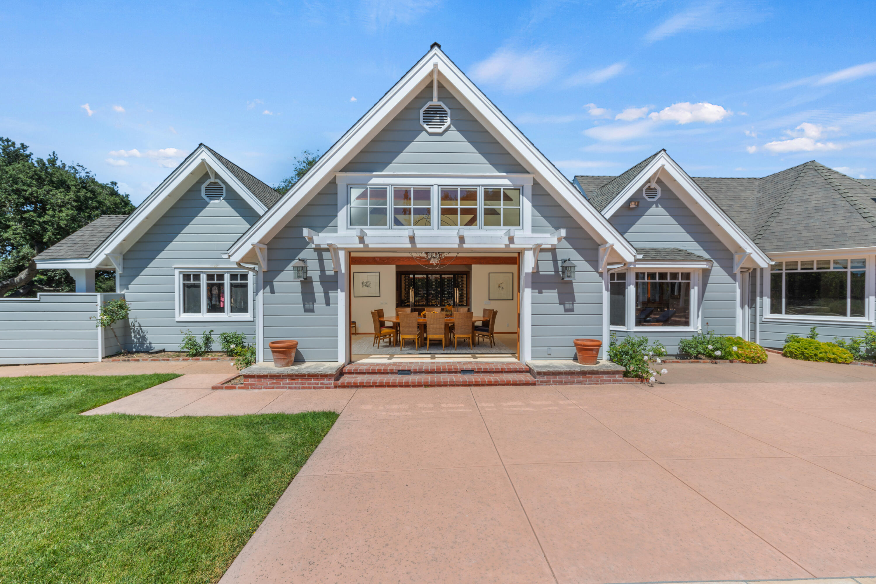 1642 Alamo Pintado Road Solvang, CA 93463 - Photo 17 of 85 a front view of a house with a yard and garage