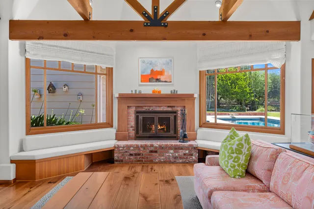 a view of a patio with a table chairs and a backyard