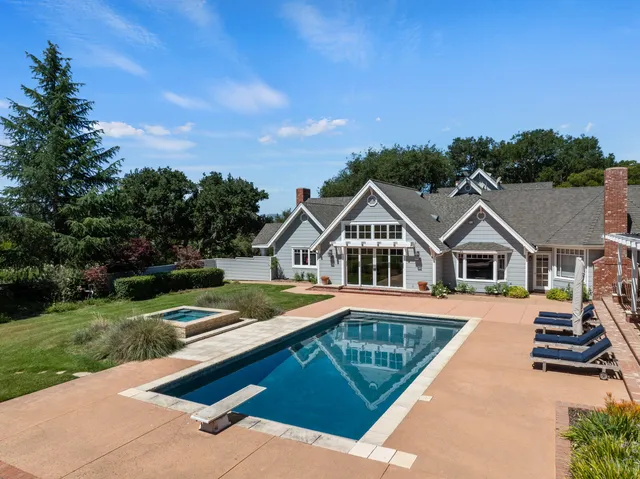 a view of a houses with pool