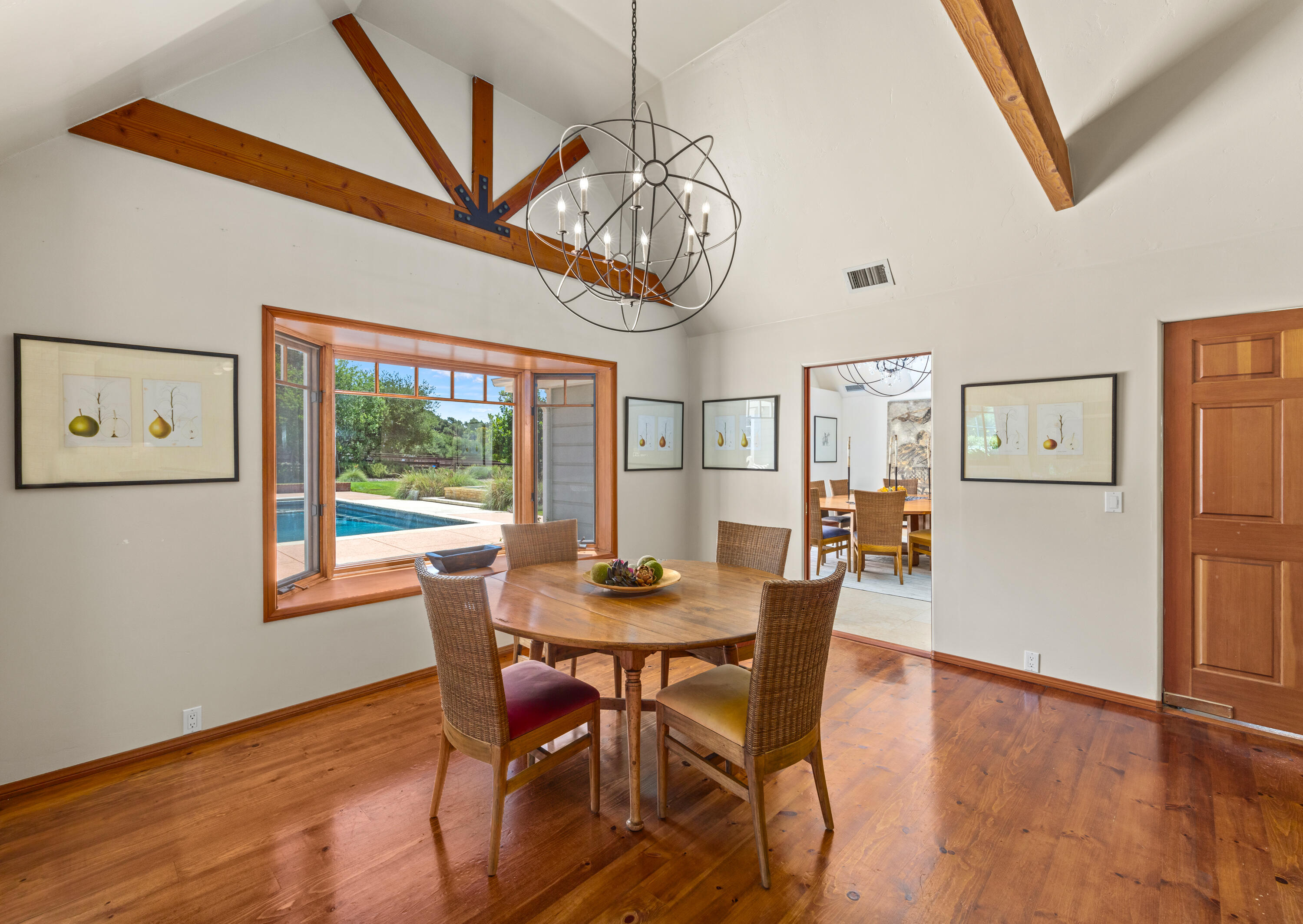 1642 Alamo Pintado Road Solvang, CA 93463 - Photo 26 of 85 a dining room with furniture a chandelier and wooden floor