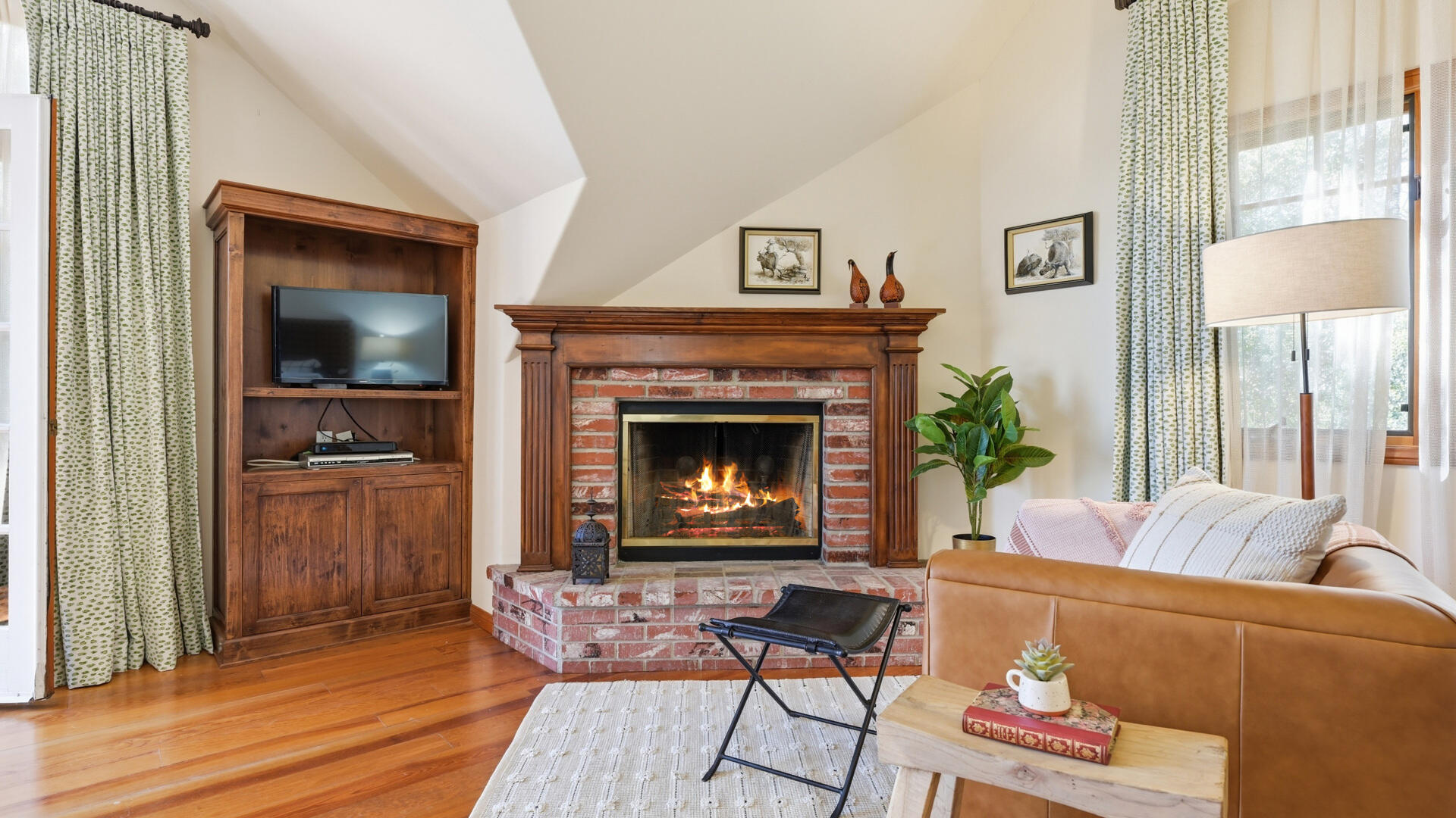 1642 Alamo Pintado Road Solvang, CA 93463 - Photo 33 of 85 a living room with furniture and a fireplace