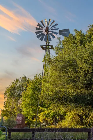 a spacious bedroom with a bed and a large window