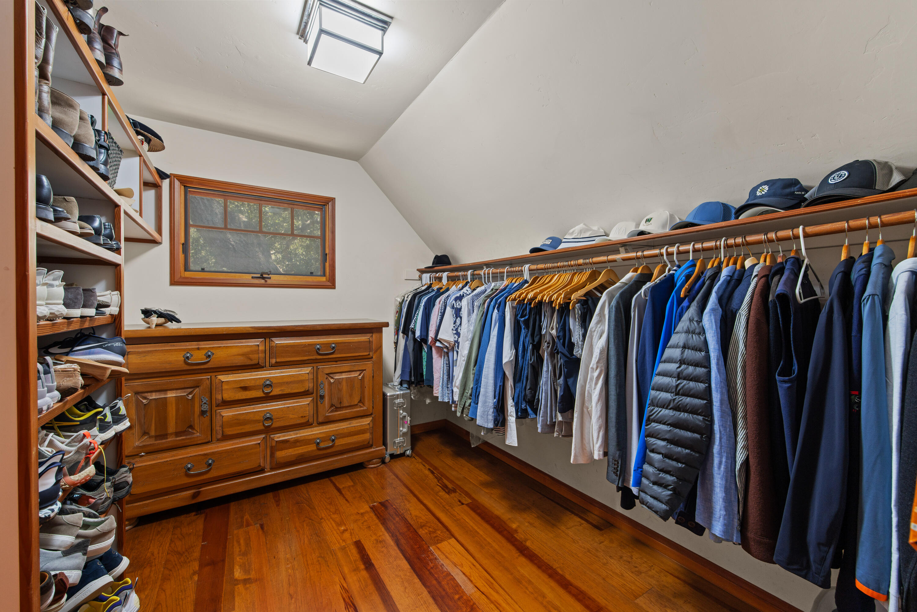 1642 Alamo Pintado Road Solvang, CA 93463 - Photo 34 of 85 a view of walk in closet with clothes and shoes