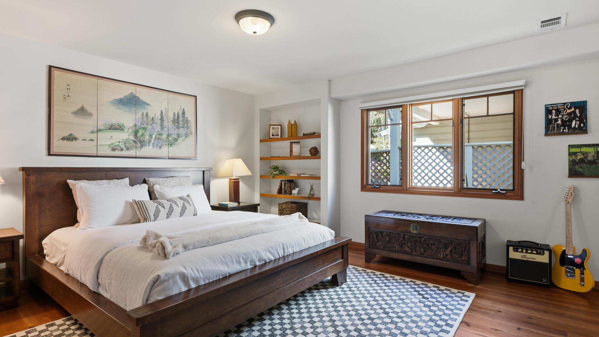 1642 Alamo Pintado Road Solvang, CA 93463 - Photo 50 of 85 a bedroom with a bed and a painting on the wall