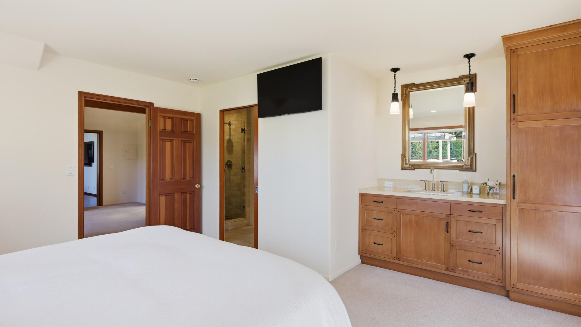 1642 Alamo Pintado Road Solvang, CA 93463 - Photo 53 of 85 a bedroom with a bed and a flat screen tv