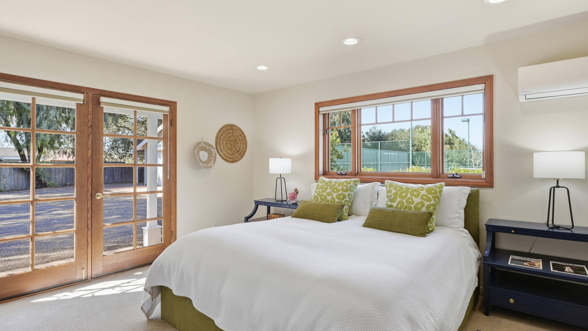 1642 Alamo Pintado Road Solvang, CA 93463 - Photo 54 of 85 a bedroom with a large bed and a large window