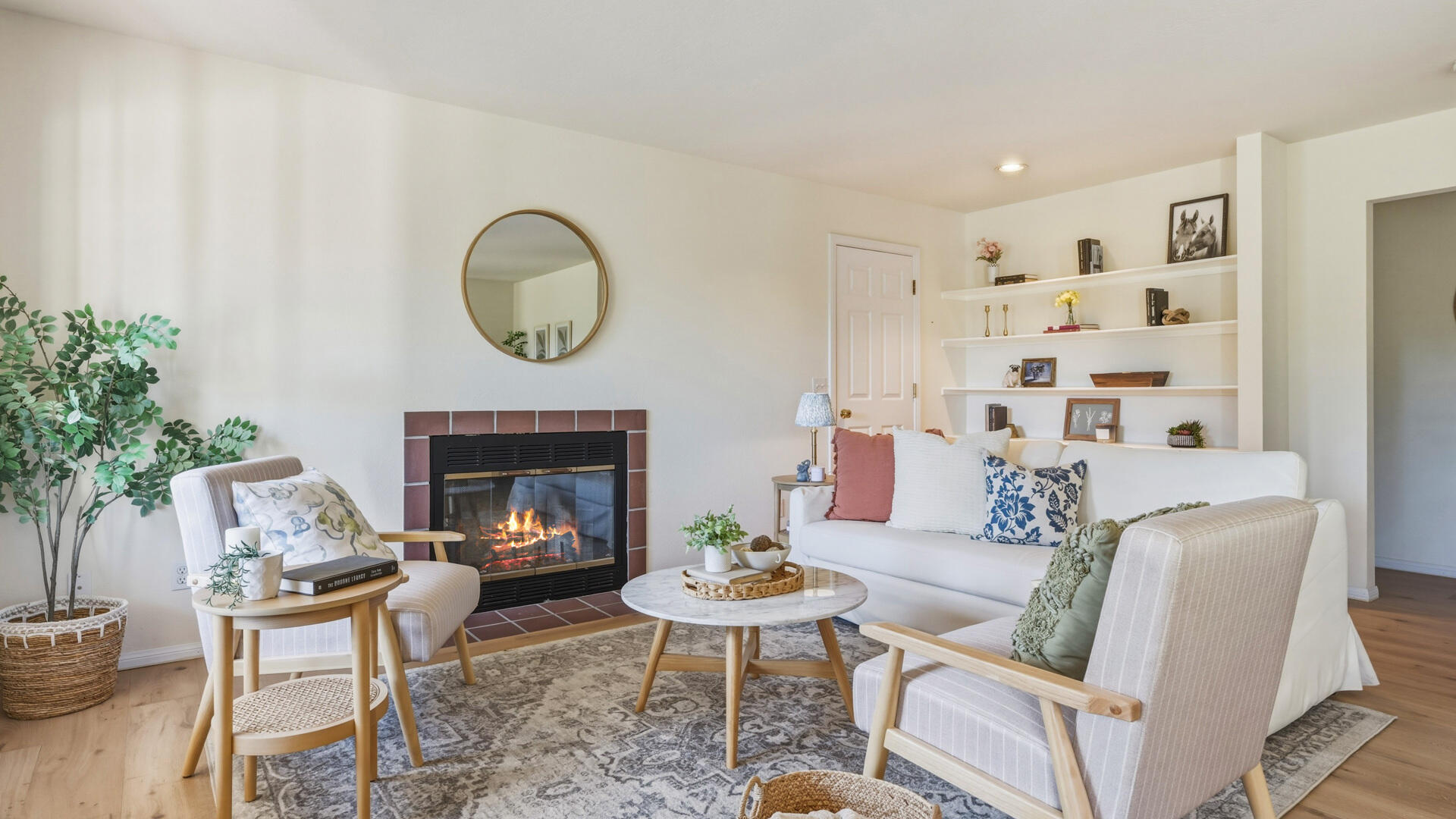 1642 Alamo Pintado Road Solvang, CA 93463 - Photo 60 of 85 a living room with furniture a fireplace and a potted plant