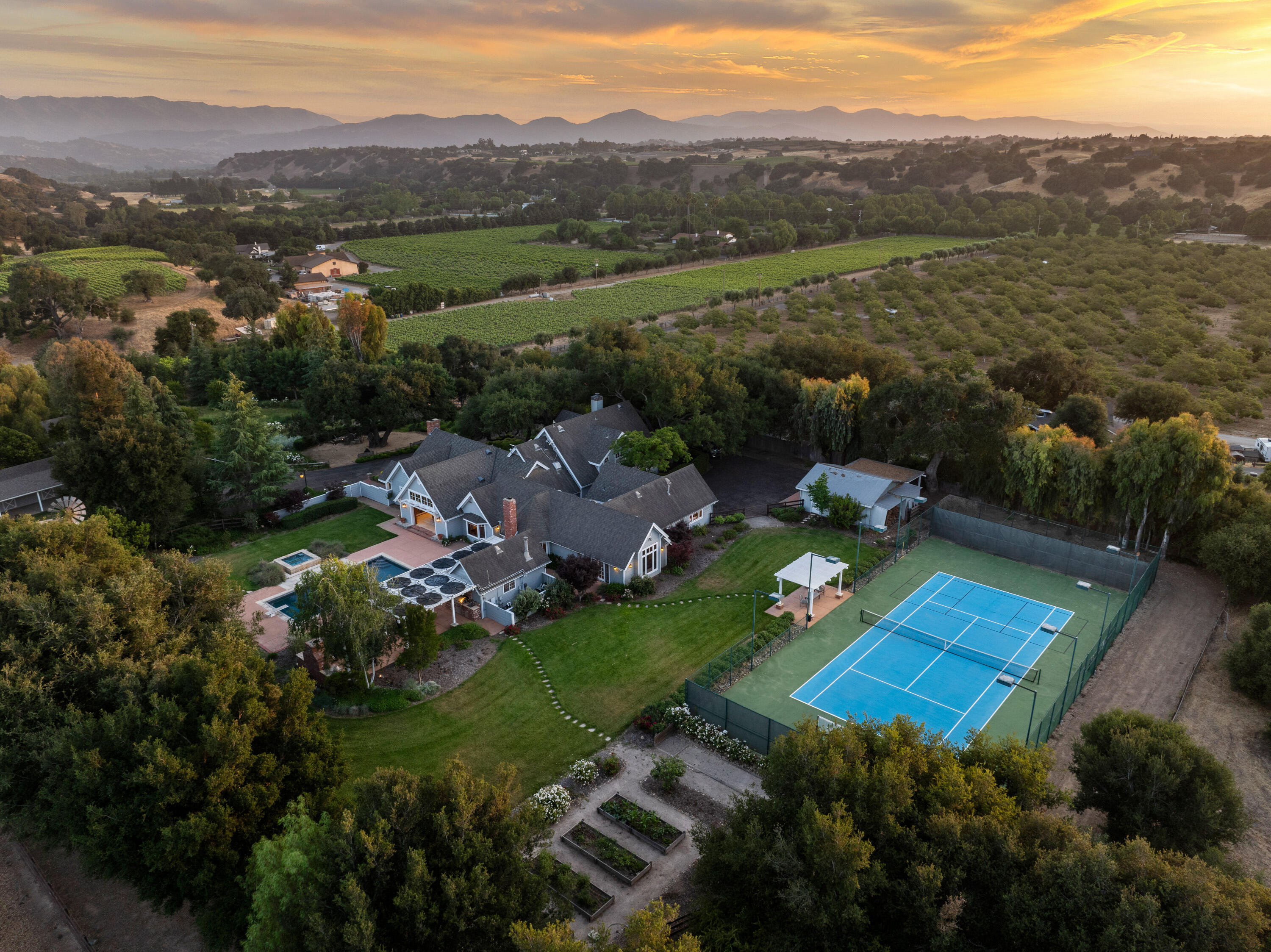 1642 Alamo Pintado Road Solvang, CA 93463 - Photo 85 of 85 an aerial view of green landscape with trees houses and mountain view