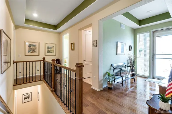 a view of a livingroom with furniture and hardwood floor
