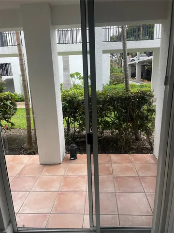 a view of a building with potted plants