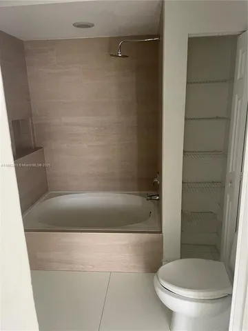 a bathroom with a shower and a toilet