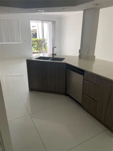 a kitchen with a sink and a window