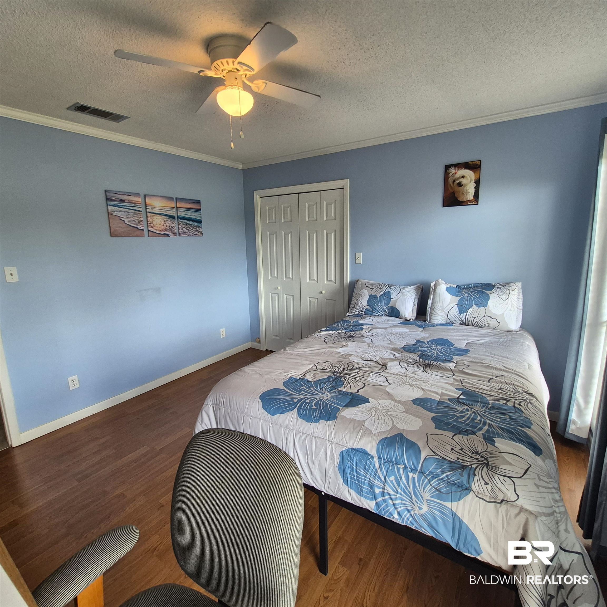 26635 Highway 41 Range, AL 36473 - Photo 28 of 74 Bedroom featuring a textured ceiling, a closet, a ceiling fan, ornamental molding, and wood finished floors