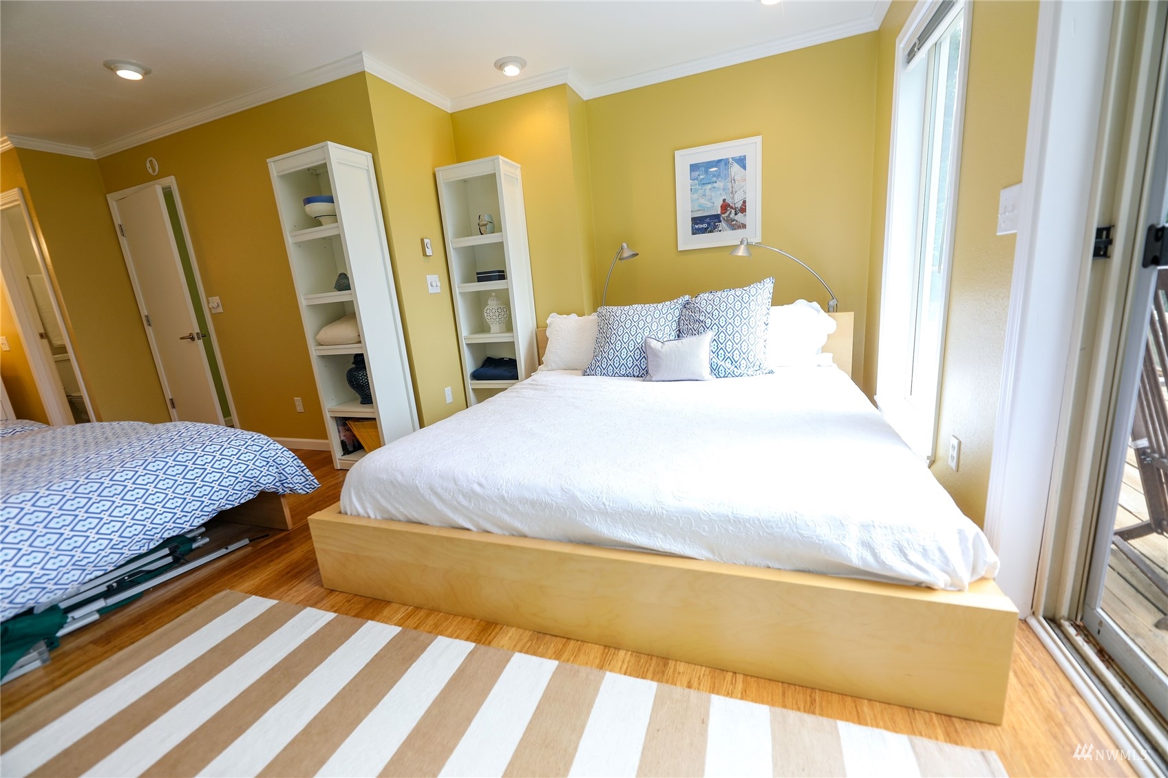 208 Reed Bay Road Decatur Island, WA 98221 - Photo 28 of 33 a bedroom with a bed and a rug