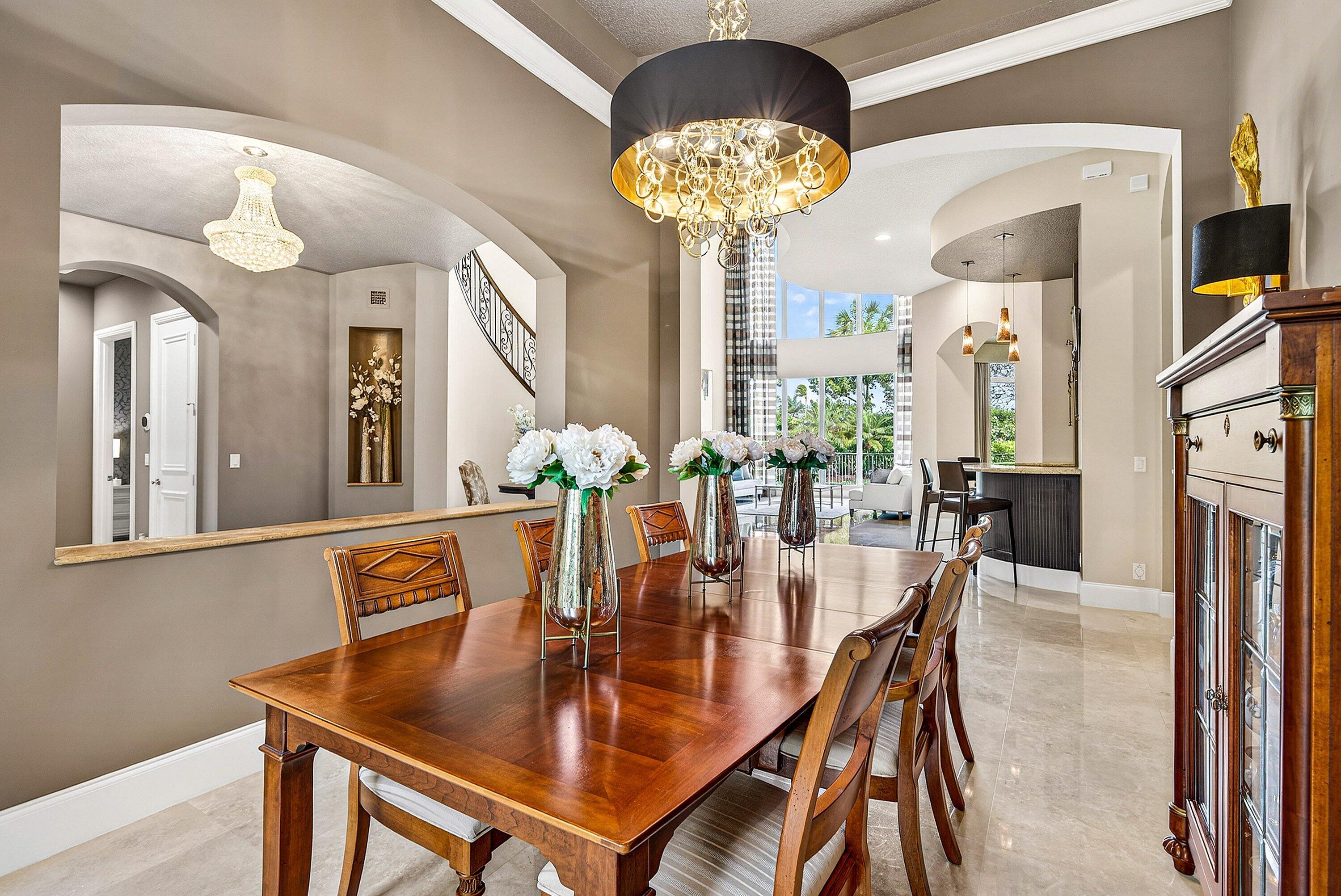 6445 Montesito Street Boca Raton, FL 33496 - Photo 18 of 86 a view of a dining room with furniture and chandelier