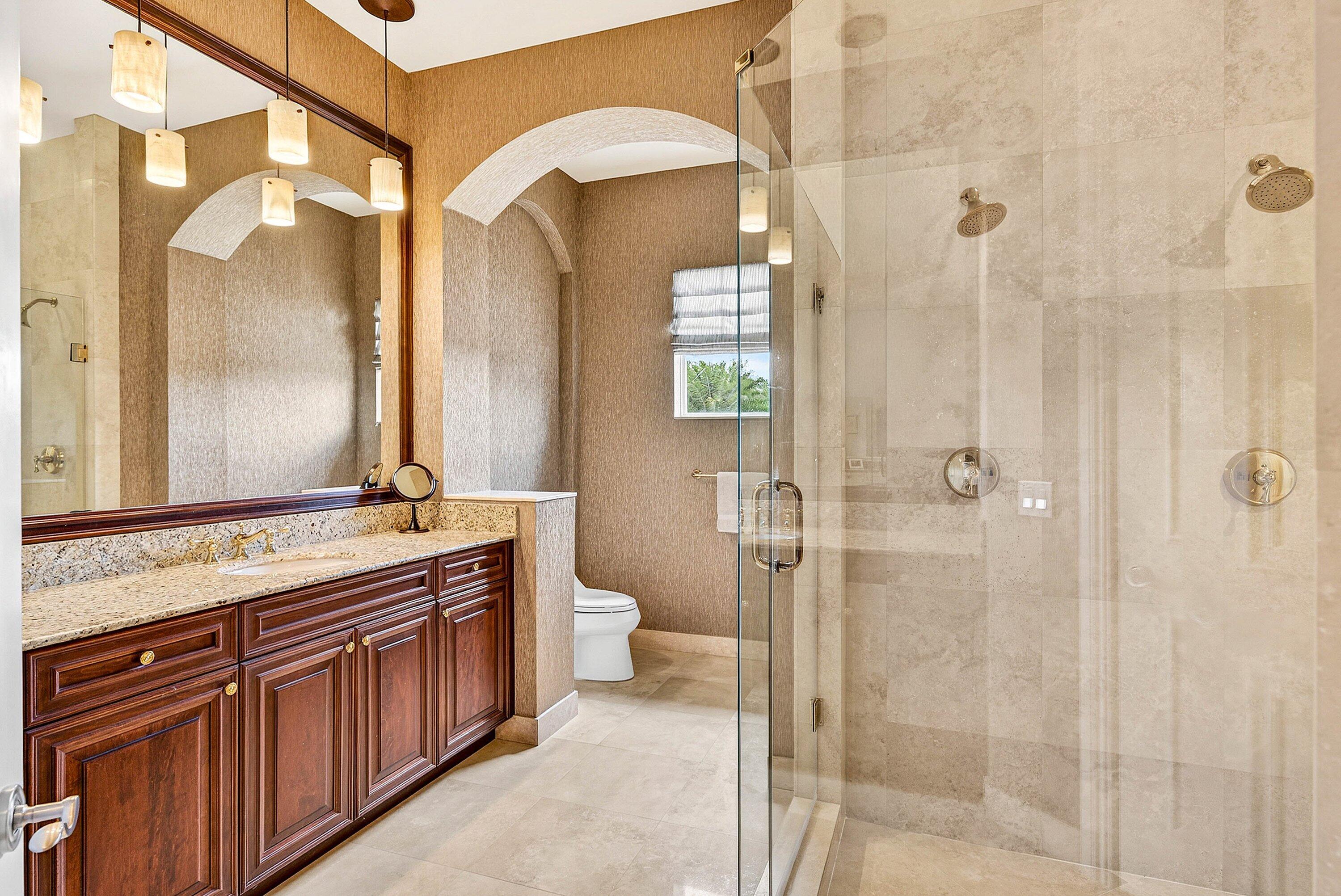 6445 Montesito Street Boca Raton, FL 33496 - Photo 50 of 86 a bathroom with a double vanity sink toilet and shower