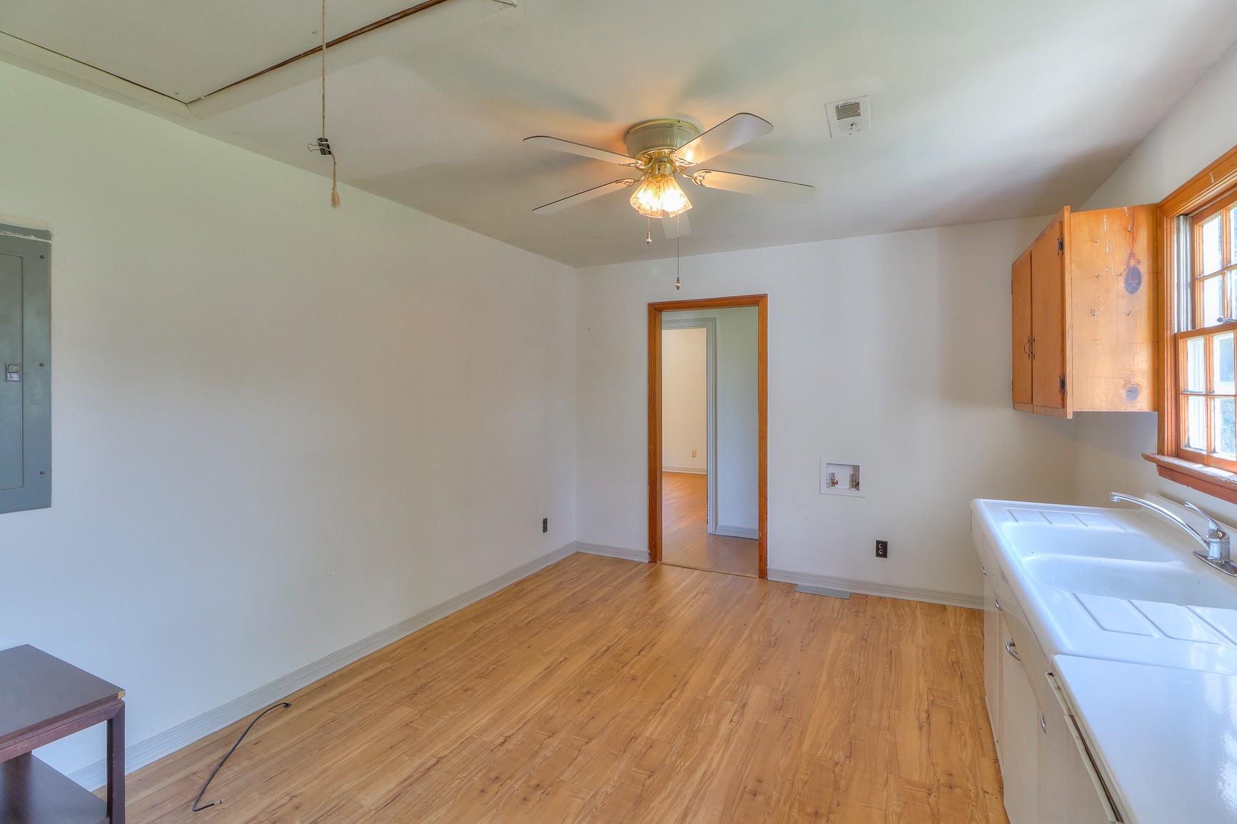 3308 Craig Bridge Road Williamsport, TN 38487 - Photo 12 of 45 a view of an empty room with window and wooden floor