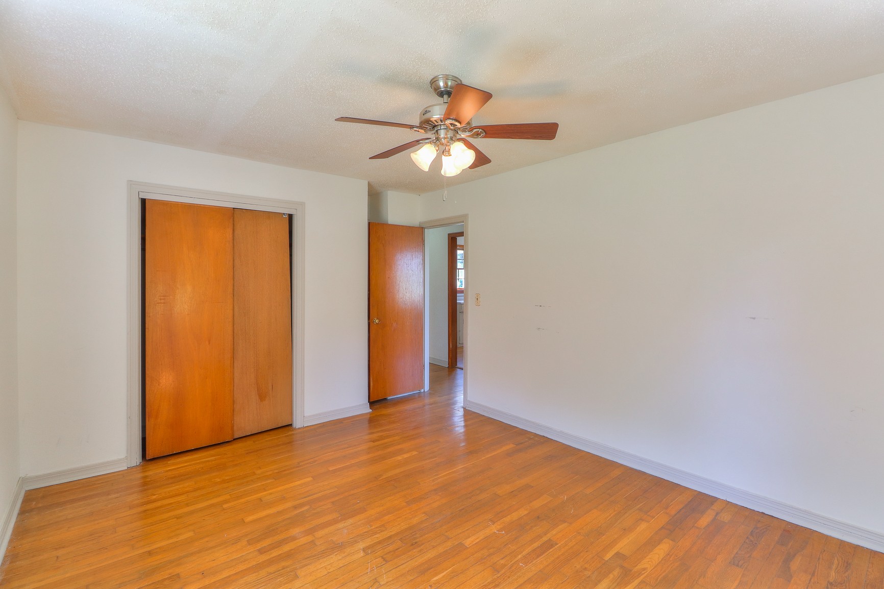 3308 Craig Bridge Road Williamsport, TN 38487 - Photo 17 of 45 a view of an empty room with window and chandelier fan