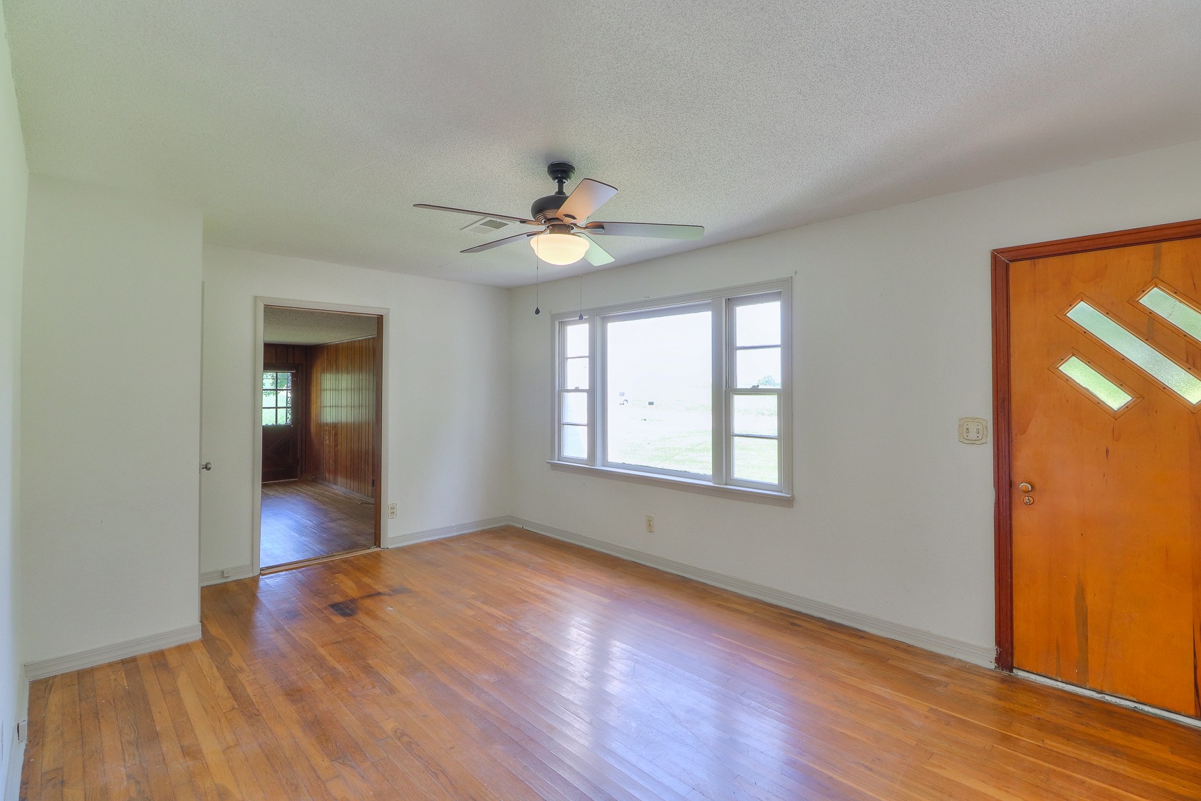 3308 Craig Bridge Road Williamsport, TN 38487 - Photo 18 of 45 a view of an empty room with window and wooden floor