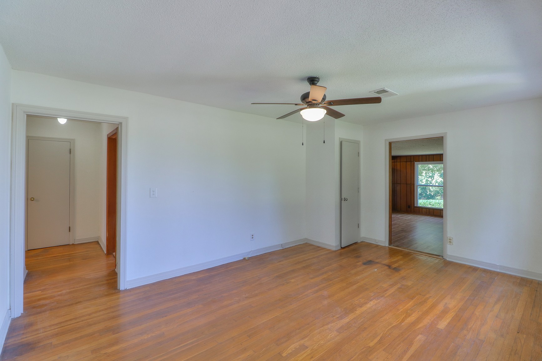 3308 Craig Bridge Road Williamsport, TN 38487 - Photo 19 of 45 a view of an empty room with wooden floor