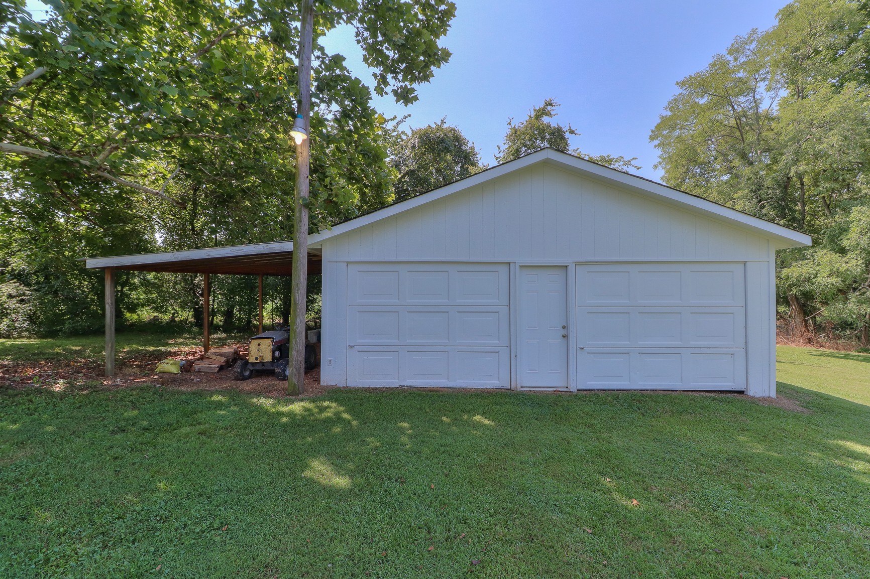 3308 Craig Bridge Road Williamsport, TN 38487 - Photo 3 of 45 a view of a backyard with a small cabin