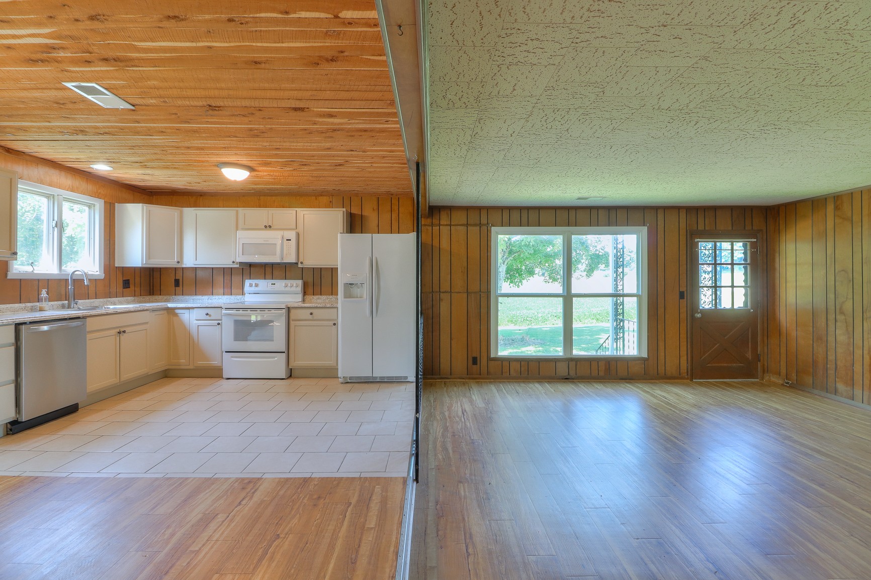 3308 Craig Bridge Road Williamsport, TN 38487 - Photo 21 of 45 a large kitchen with wooden floors and white stainless steel appliances