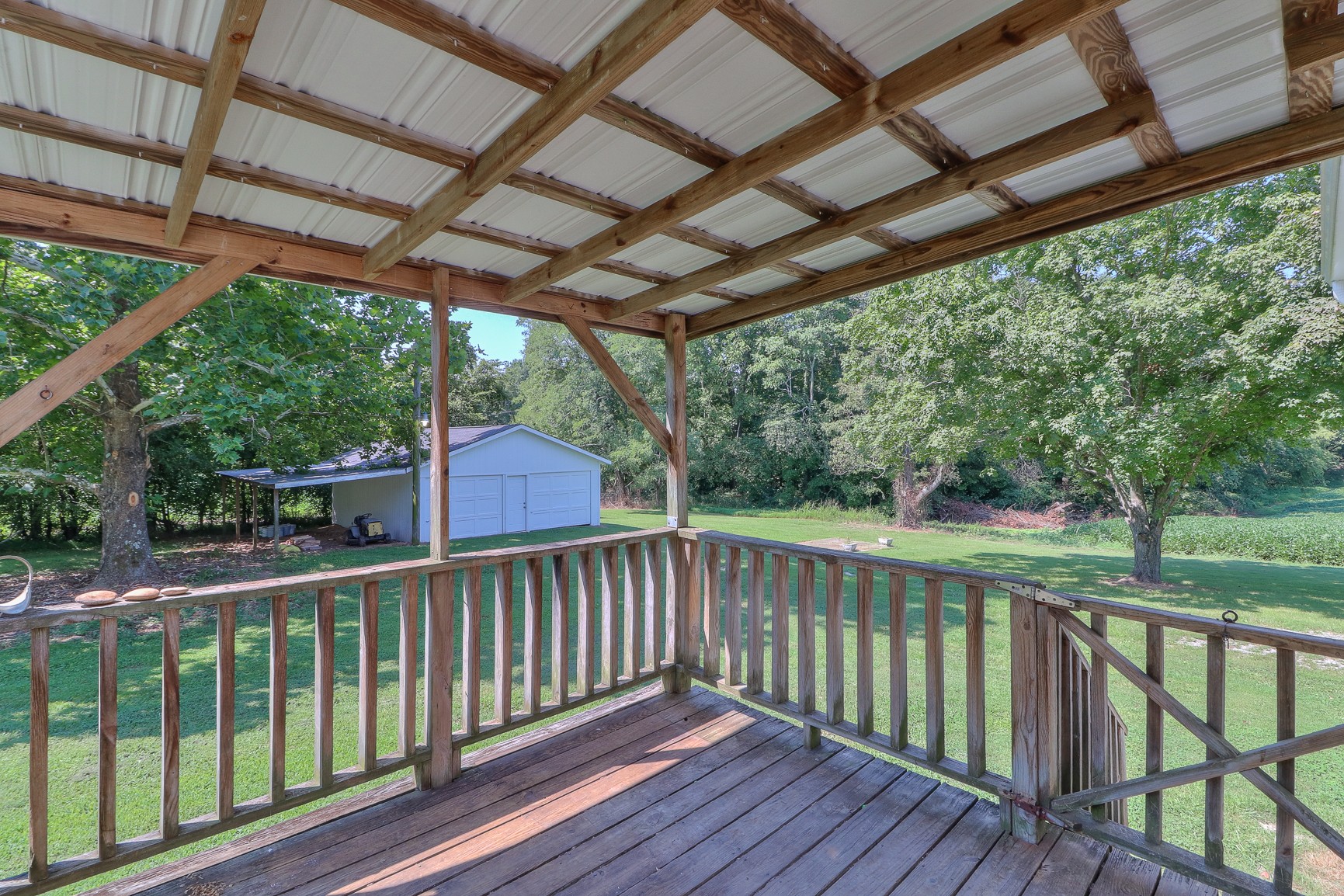 3308 Craig Bridge Road Williamsport, TN 38487 - Photo 24 of 45 a view of a wooden deck next to a yard