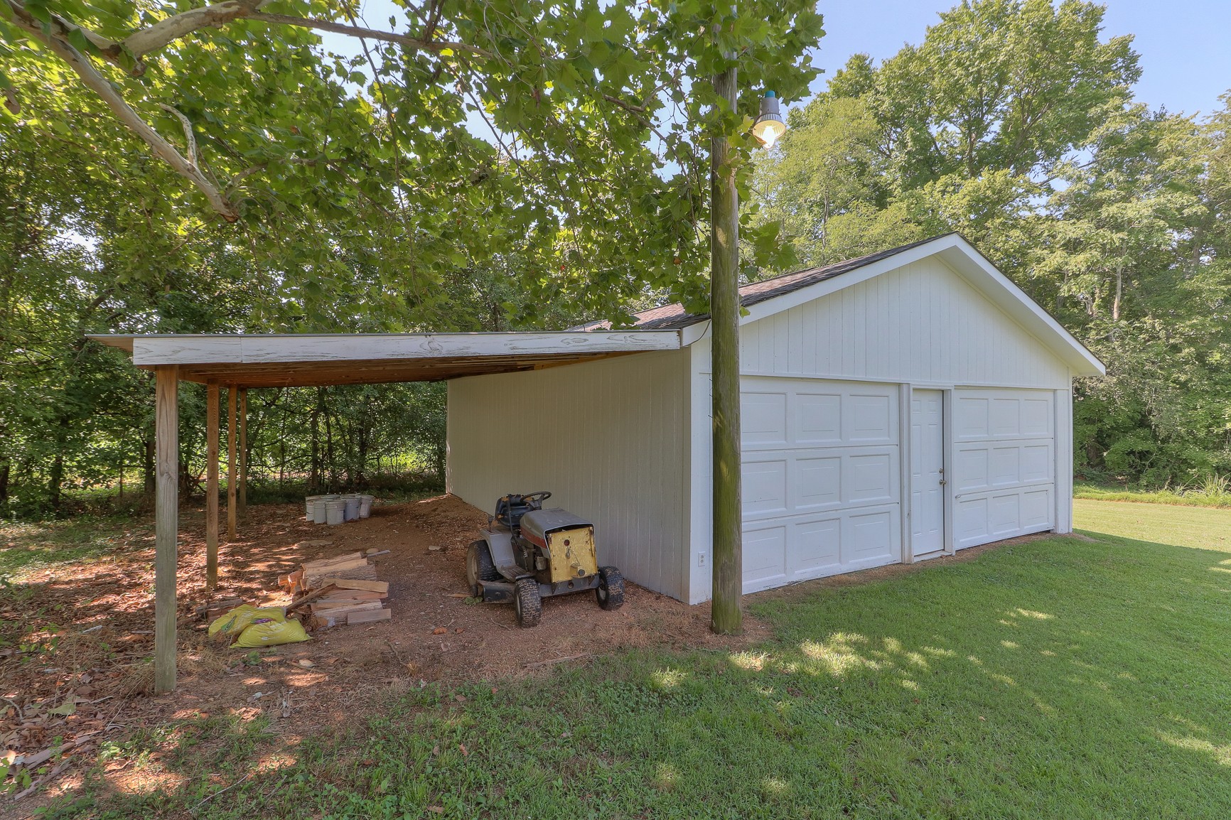 3308 Craig Bridge Road Williamsport, TN 38487 - Photo 27 of 45 a backyard of a house with table and chairs