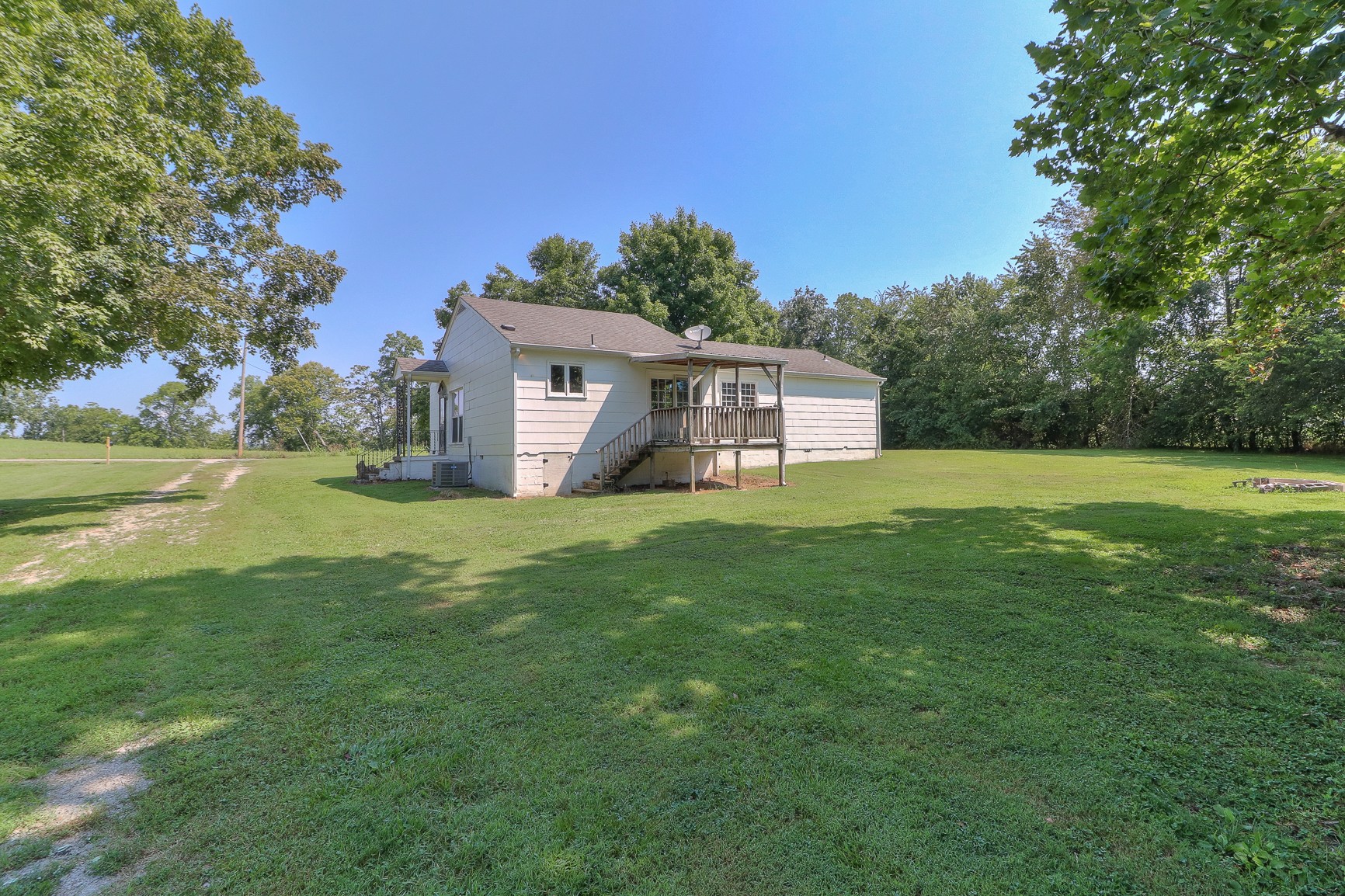 3308 Craig Bridge Road Williamsport, TN 38487 - Photo 28 of 45 a view of a big house with a big yard and large trees