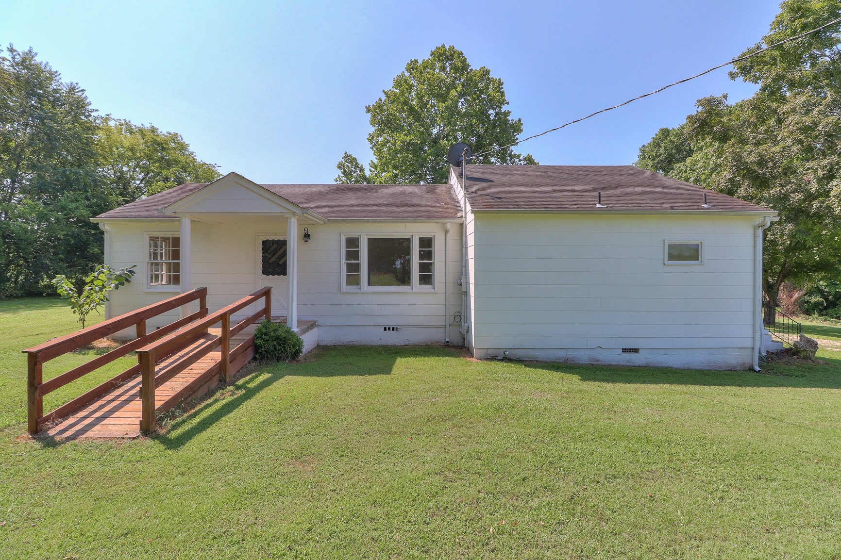 3308 Craig Bridge Road Williamsport, TN 38487 - Photo 33 of 45 a view of a house with a yard and a garden