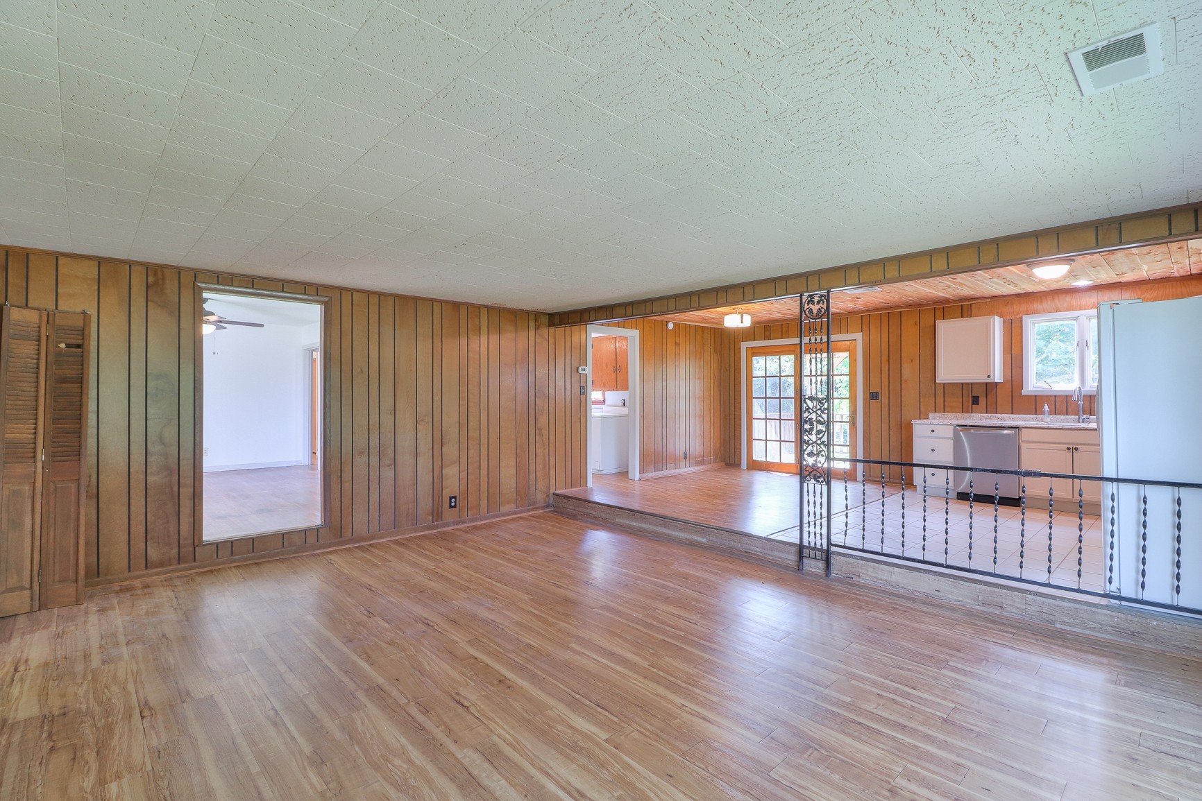 3308 Craig Bridge Road Williamsport, TN 38487 - Photo 5 of 45 an empty room with wooden floor and windows