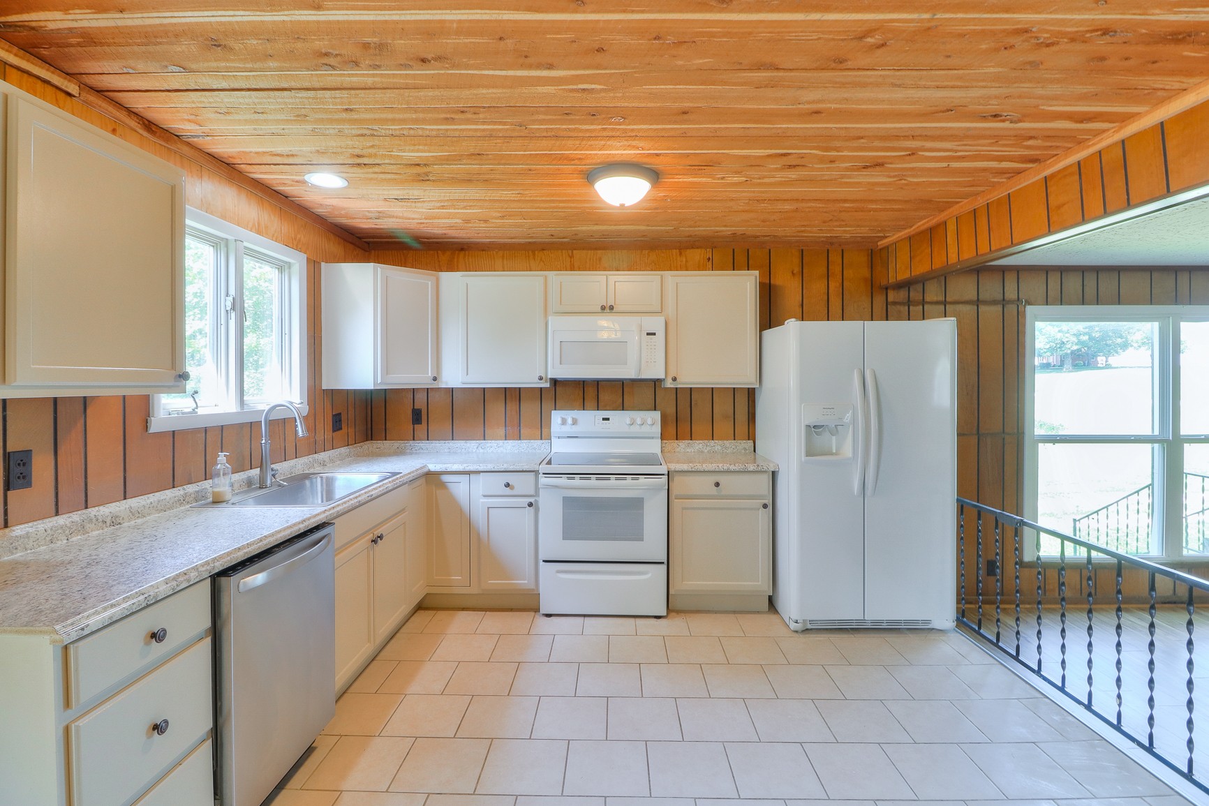 3308 Craig Bridge Road Williamsport, TN 38487 - Photo 8 of 45 a kitchen with a refrigerator and a sink