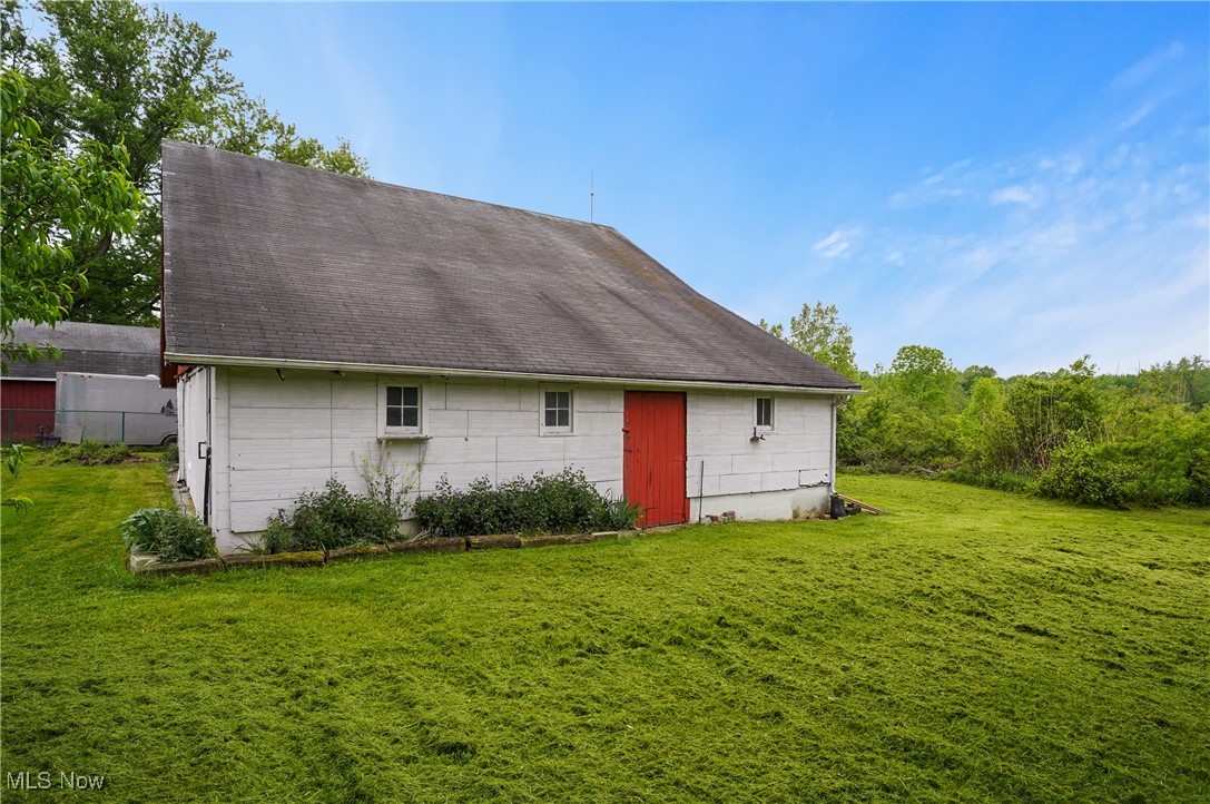 12395 Carter Road Painesville, OH 44077 - Photo 10 of 39 Back of property with a shingled roof