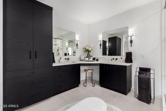 a bathroom with a sink vanity and a mirror