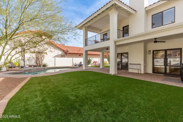 a view of a house with pool table and chairs
