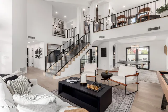 a living room with furniture or stairs and a wooden floor