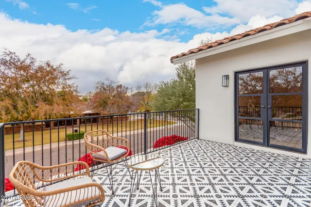 a view of a room with furniture and wooden floor