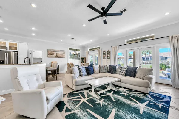 a kitchen with stainless steel appliances white cabinets white stove a refrigerator and a microwave