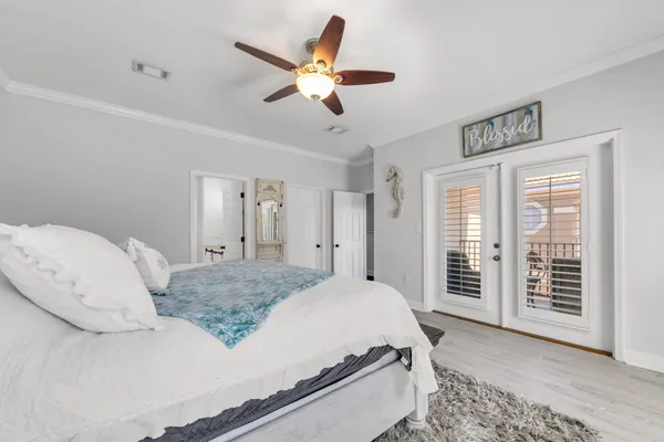 a bed room with a bed and a large window