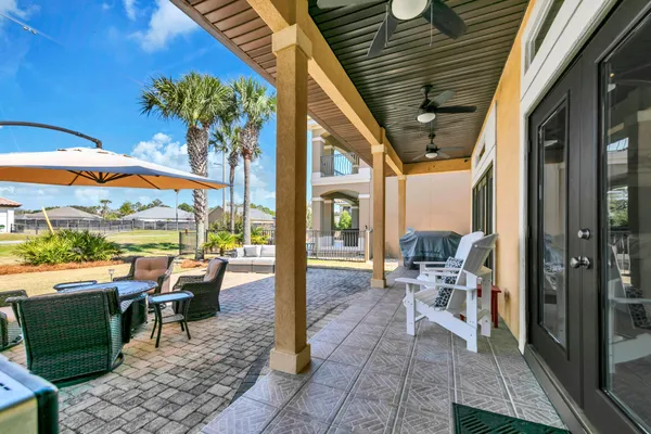 an aerial view of a house with a swimming pool yard and outdoor seating