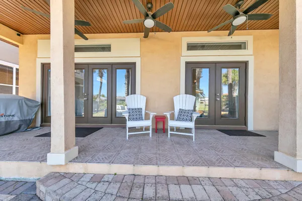 a view of a patio with a table chairs and a patio