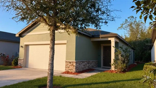 a house with trees in the background